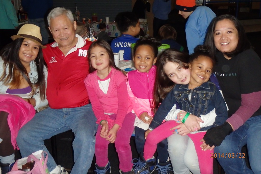 Roy's two children and  some grandchildren pose for the camera (2014). 