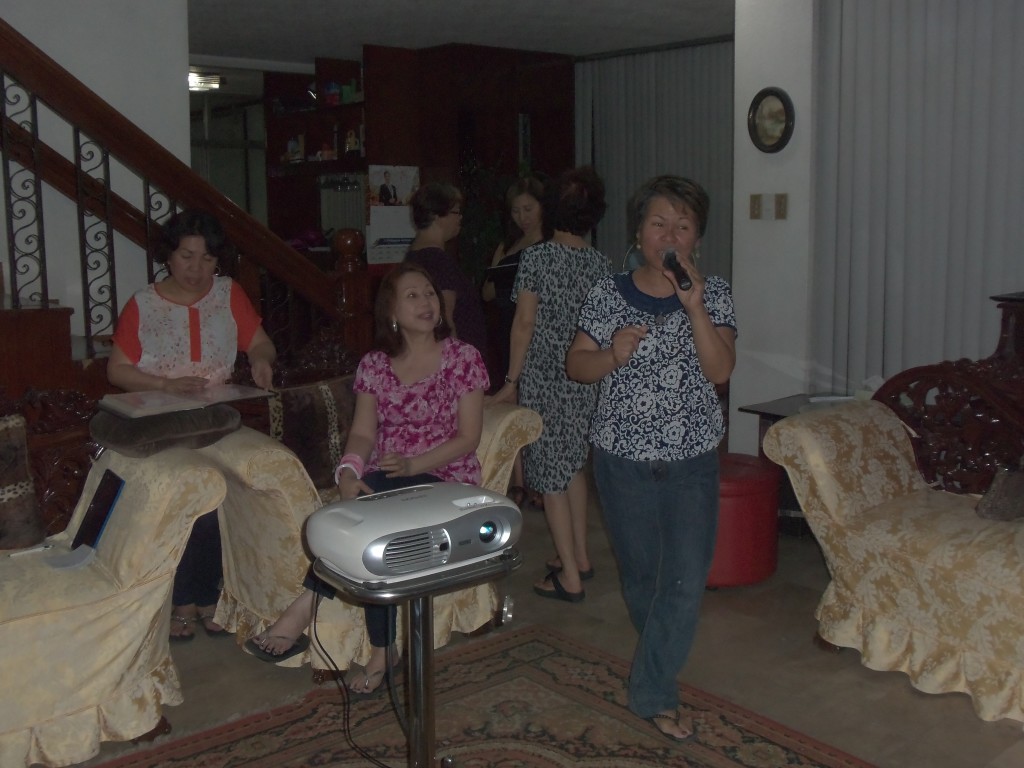 Singing karaoke with a twist with family in the Philippines.