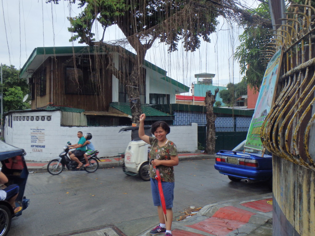 Getting IN TOUCH with the tree. Only in the Philippines.