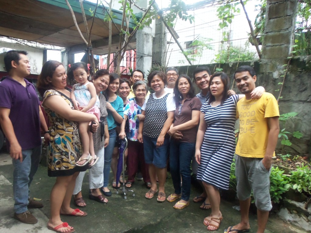 Of children, sons-in-law, and grandchildren. Our big family with Nanay in multicolored shirt. This picture was taken in 2014.